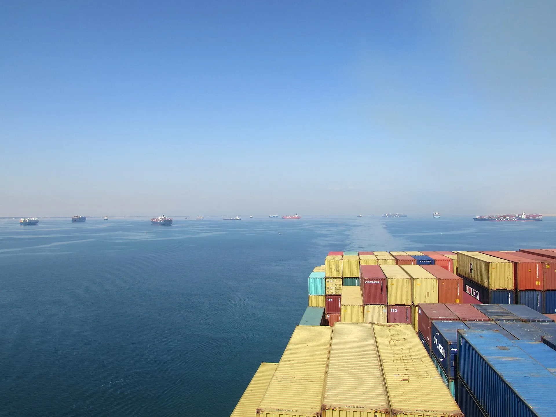Stacked shipping containers on a cargo ship deck
